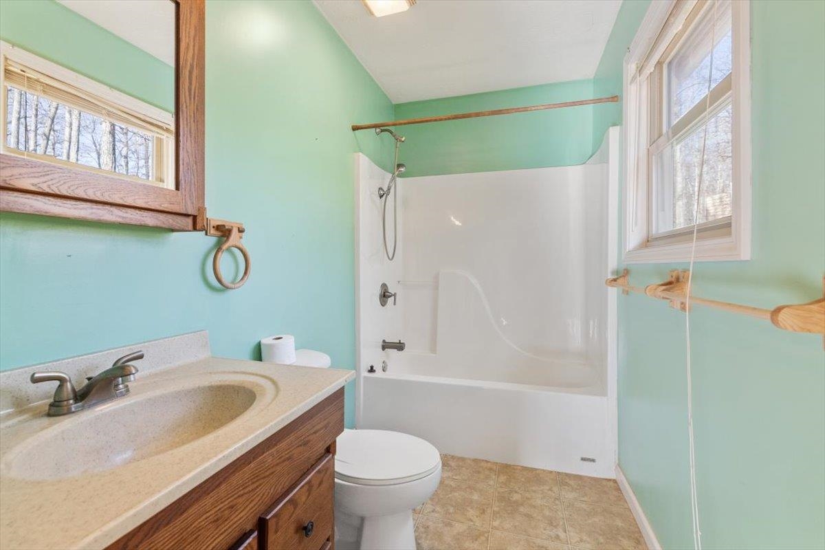 1182 Mullins Road Rio, WV 26755 - Photo 21 of 37 a bathroom with a sink toilet and shower
