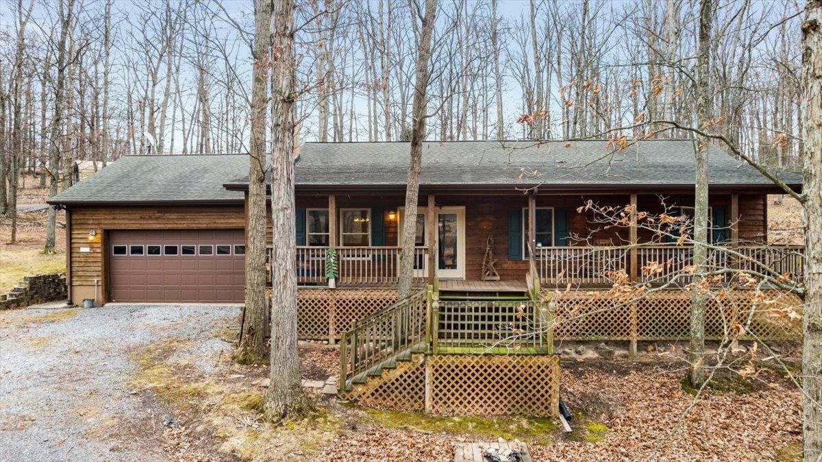 1182 Mullins Road Rio, WV 26755 - Photo 32 of 37 a front view of a house with basket ball court and outdoor seating