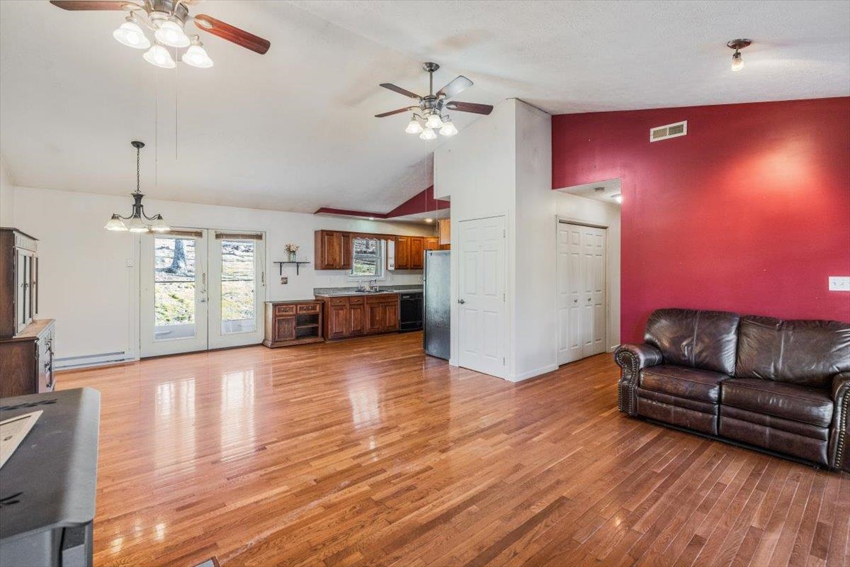 1182 Mullins Road Rio, WV 26755 - Photo 5 of 37 a living room with furniture and a wooden floor