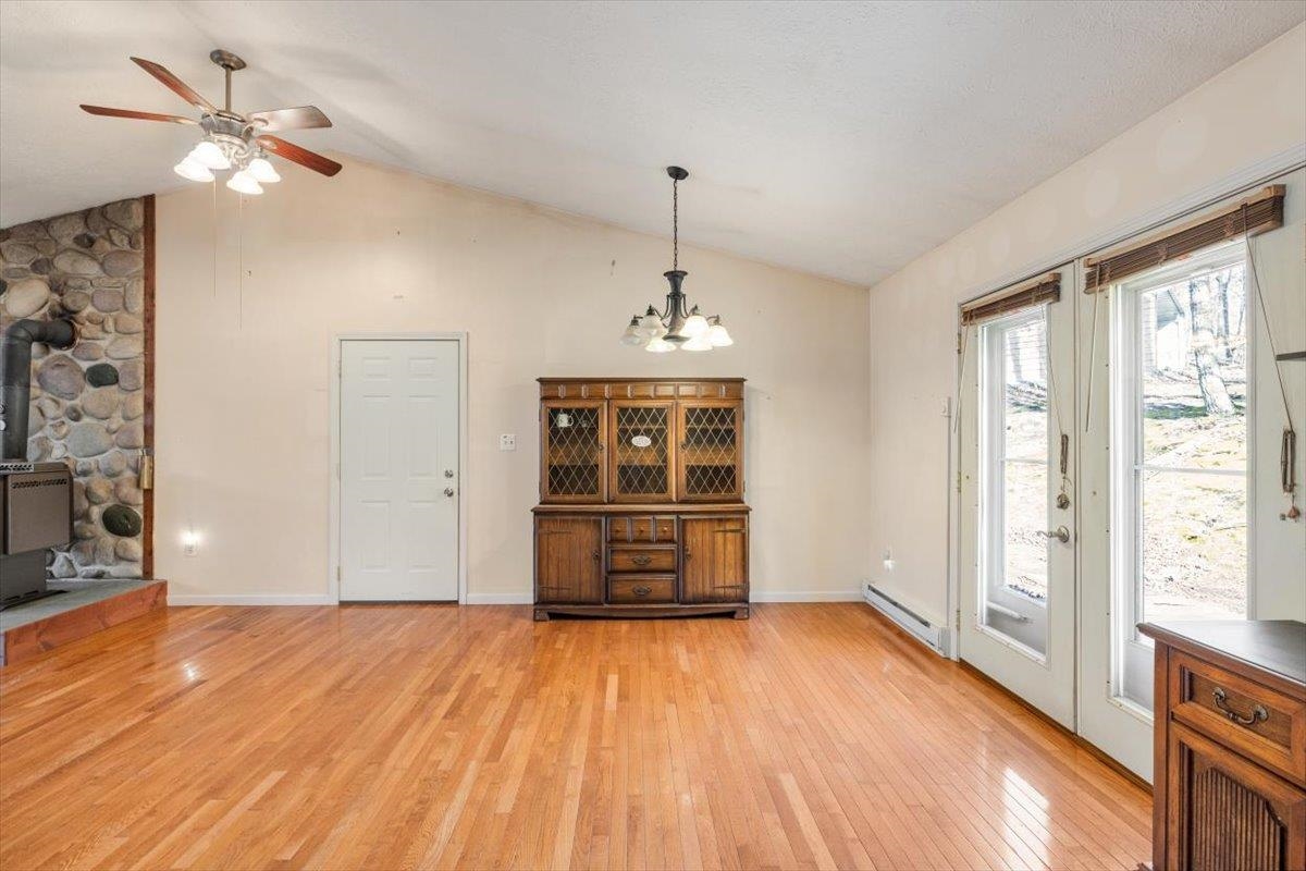 1182 Mullins Road Rio, WV 26755 - Photo 8 of 37 wooden floor in an empty room with a window