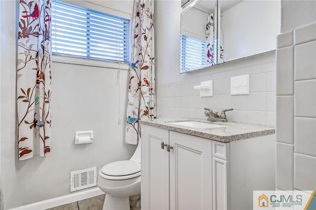 3020 Cheesequake Road Old Bridge, NJ 08859 - Photo 16 of 25 a bathroom with a sink and a toilet