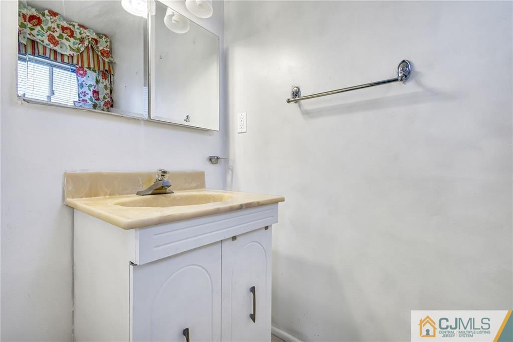 3020 Cheesequake Road Old Bridge, NJ 08859 - Photo 20 of 25 a utility room with a sink and cabinets