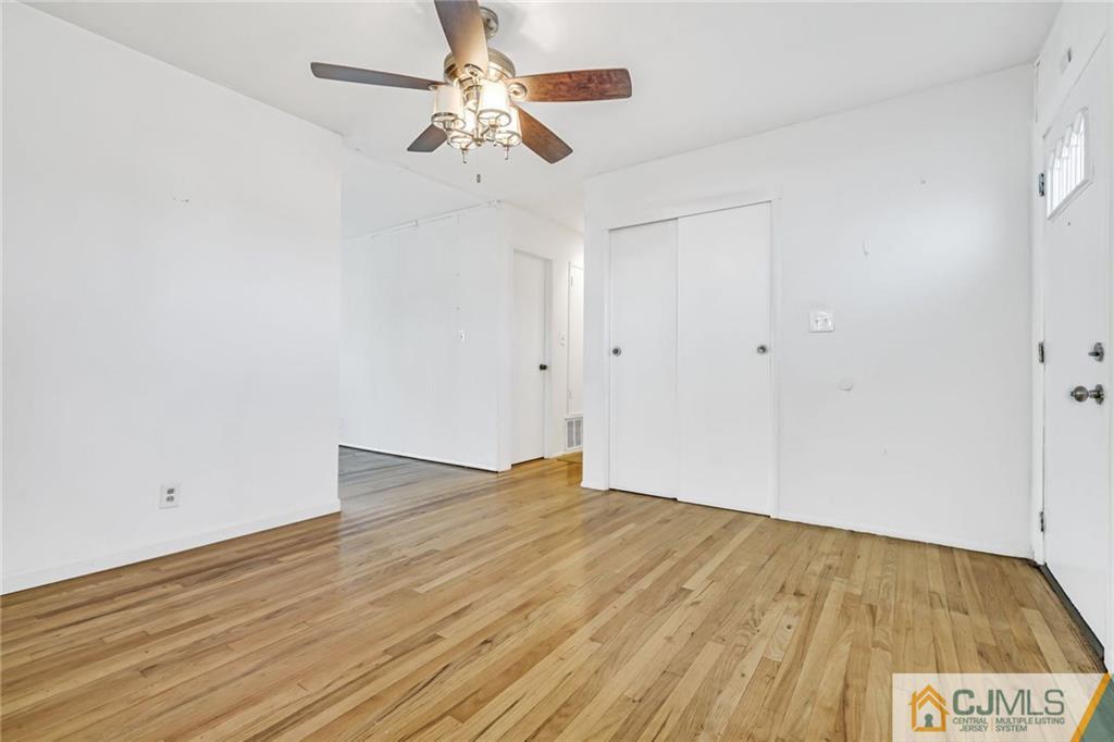 3020 Cheesequake Road Old Bridge, NJ 08859 - Photo 6 of 25 a view of an empty room with wooden floor