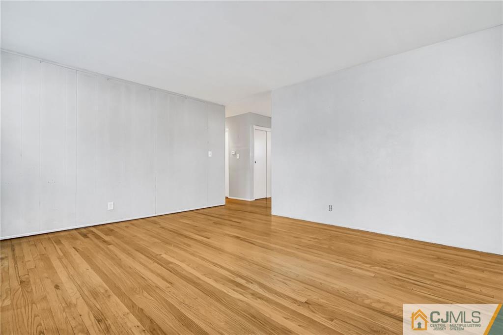 3020 Cheesequake Road Old Bridge, NJ 08859 - Photo 8 of 25 a view of an empty room and wooden floor