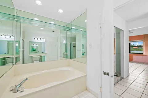 a bathroom with a bathtub and a shower