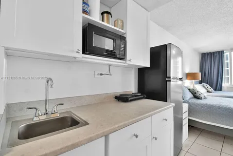 a kitchen with a sink and a microwave
