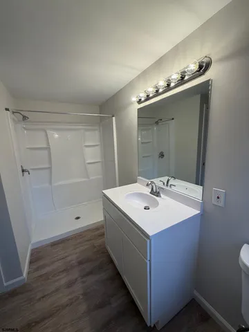 a bathroom with a sink and mirror