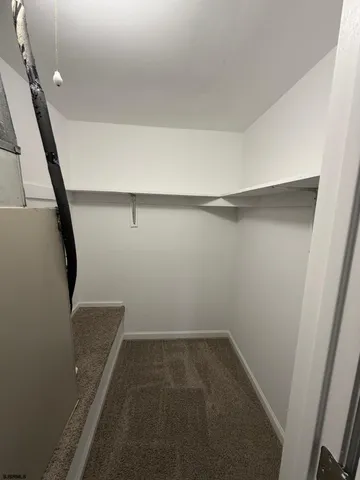 a view of storage and utility room with stairs