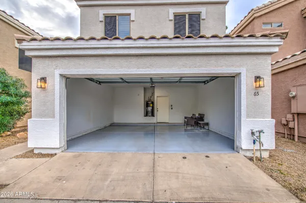 a view of a backyard with wooden fence