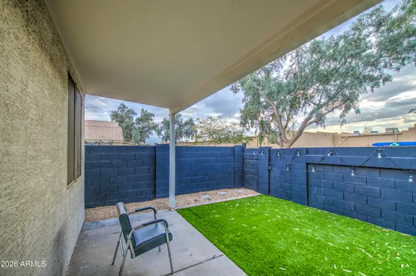 a view of yard from a backyard