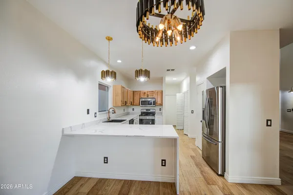 a bathroom with a sink a mirror and a shower
