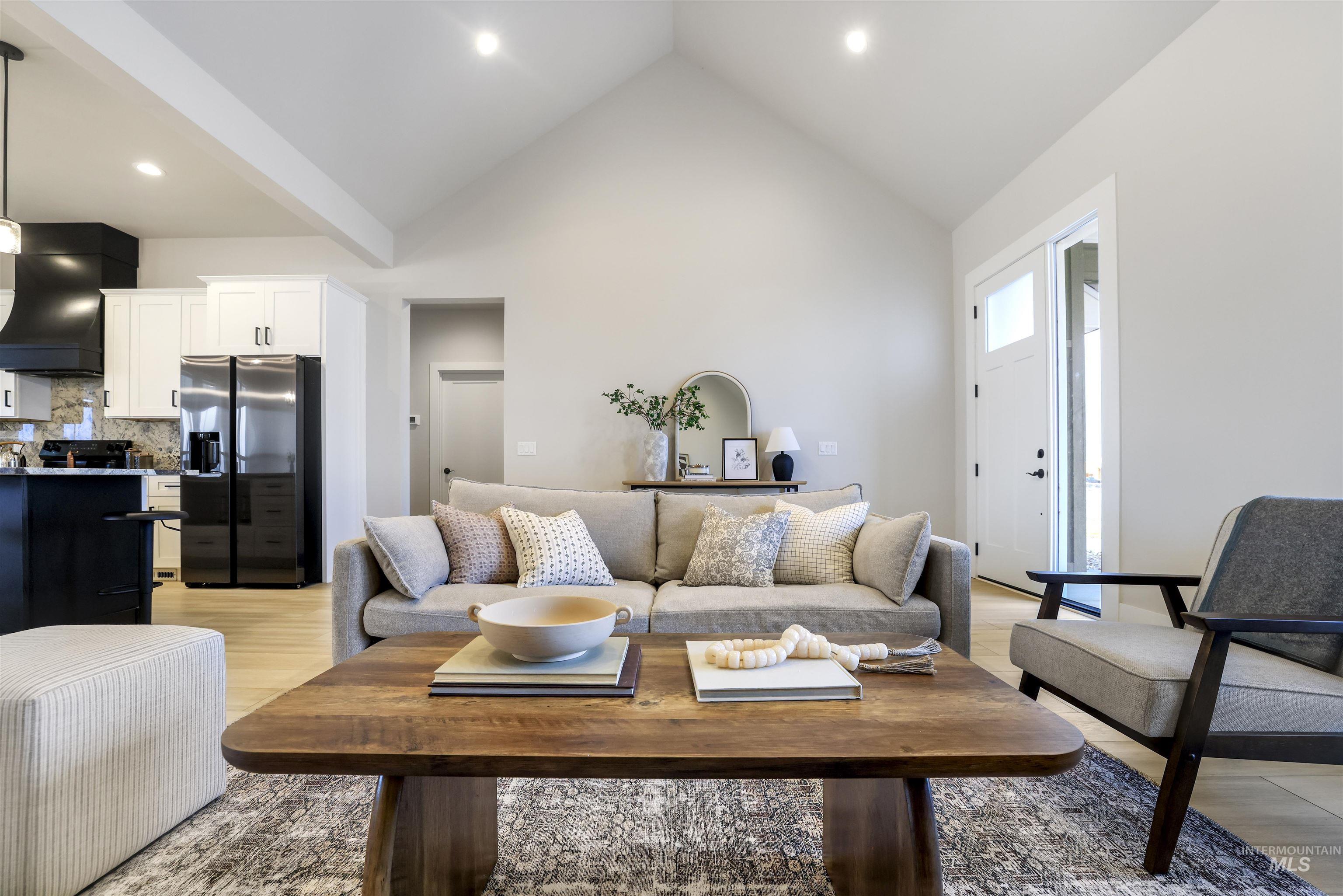 262 Ferdinand Circle Burley, ID 83318 - Photo 12 of 50 Living area with high vaulted ceiling, light wood-type flooring, and recessed lighting
