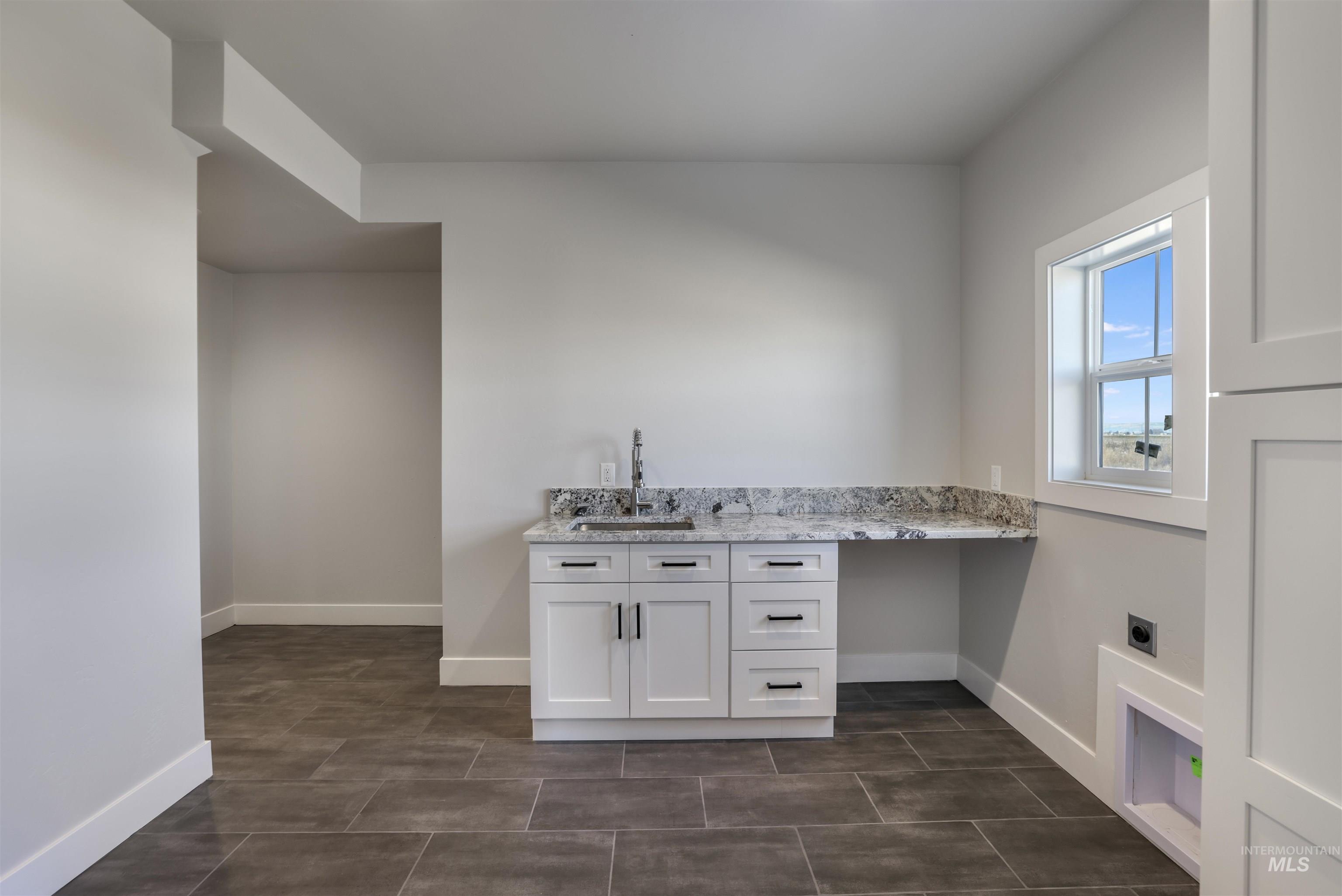 262 Ferdinand Circle Burley, ID 83318 - Photo 27 of 50 Washroom featuring hookup for an electric dryer and cabinet space