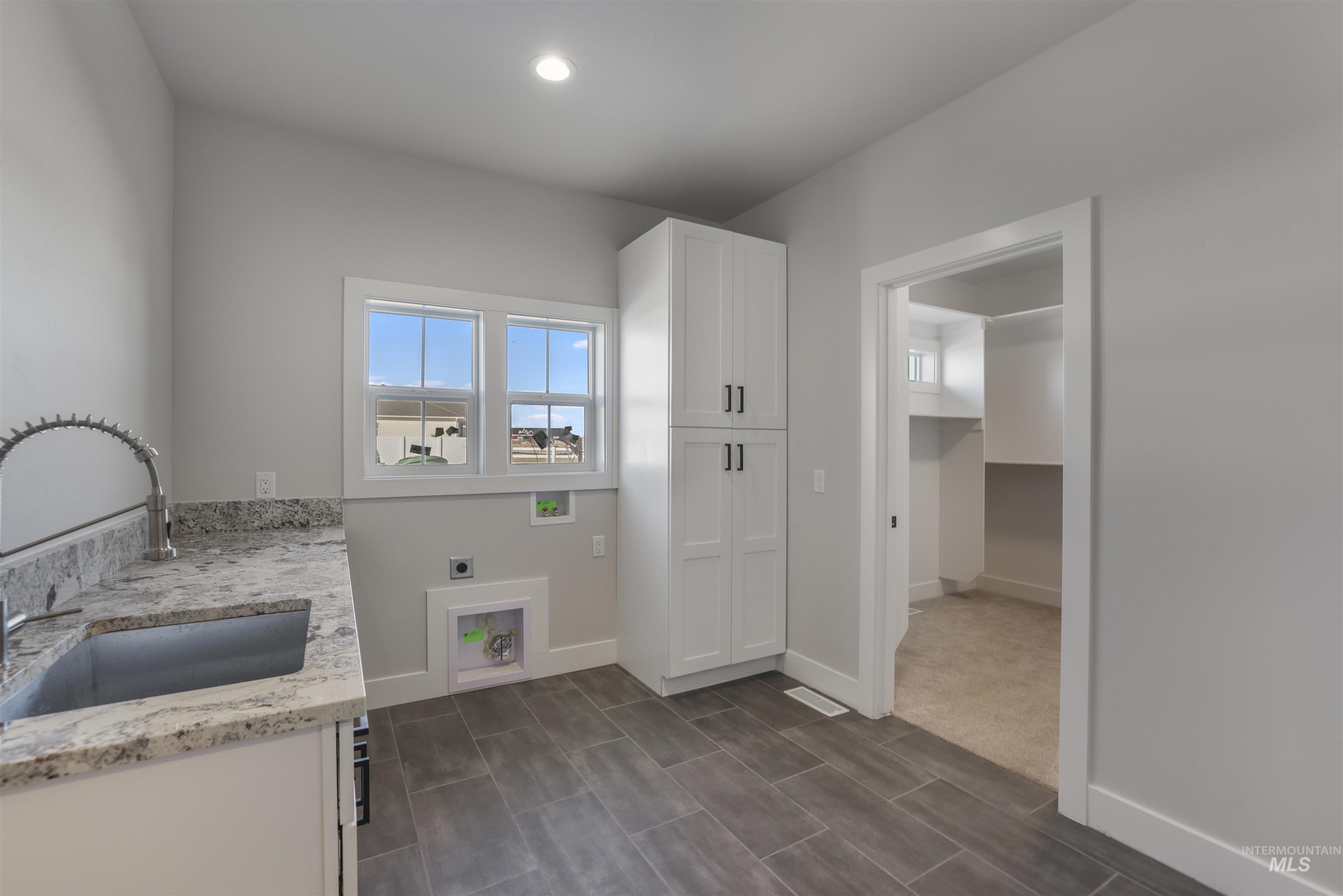 262 Ferdinand Circle Burley, ID 83318 - Photo 28 of 50 Washroom with hookup for an electric dryer, cabinet space, washer hookup, and recessed lighting