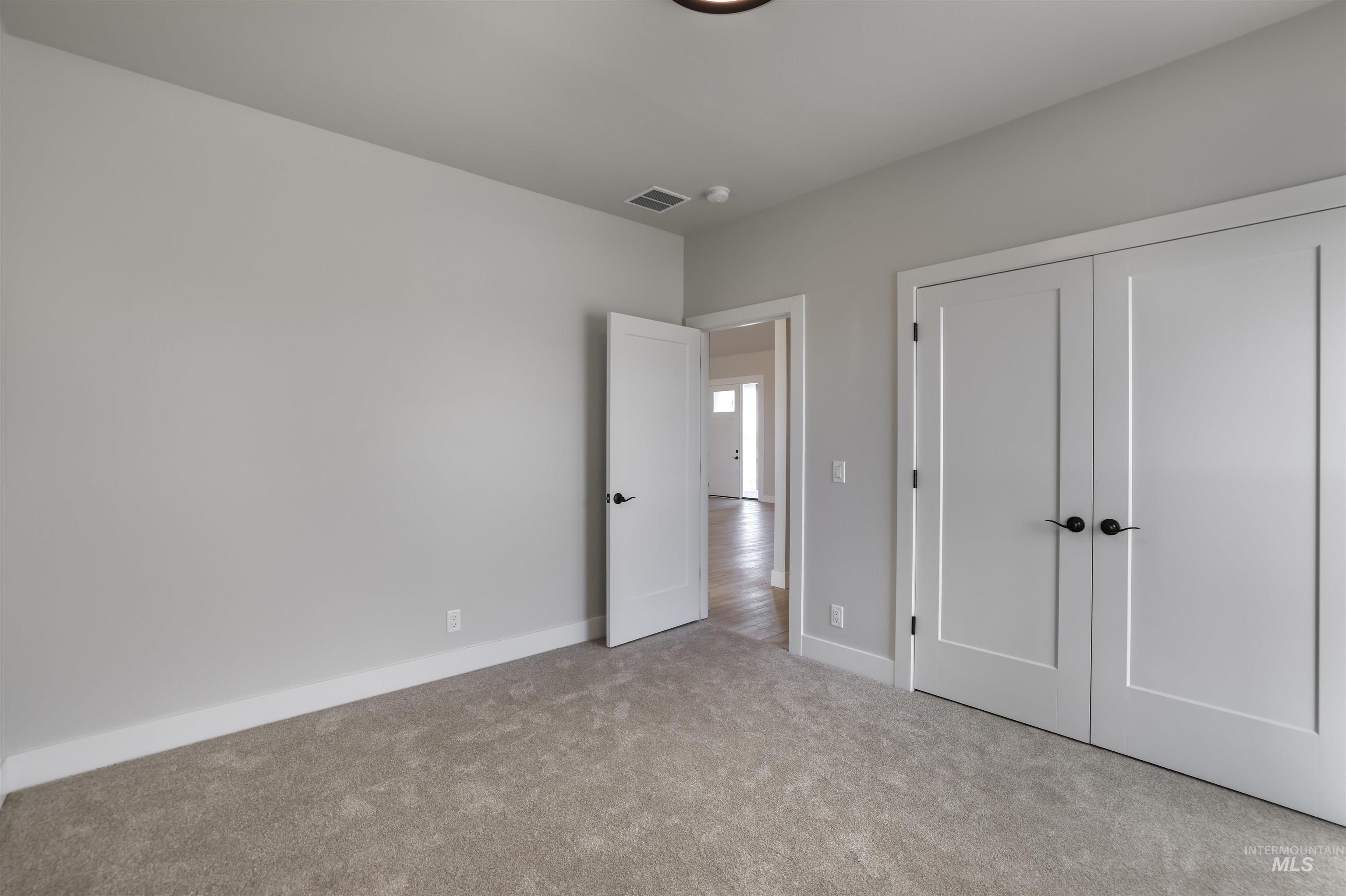 262 Ferdinand Circle Burley, ID 83318 - Photo 30 of 50 Bedroom featuring carpet and a closet