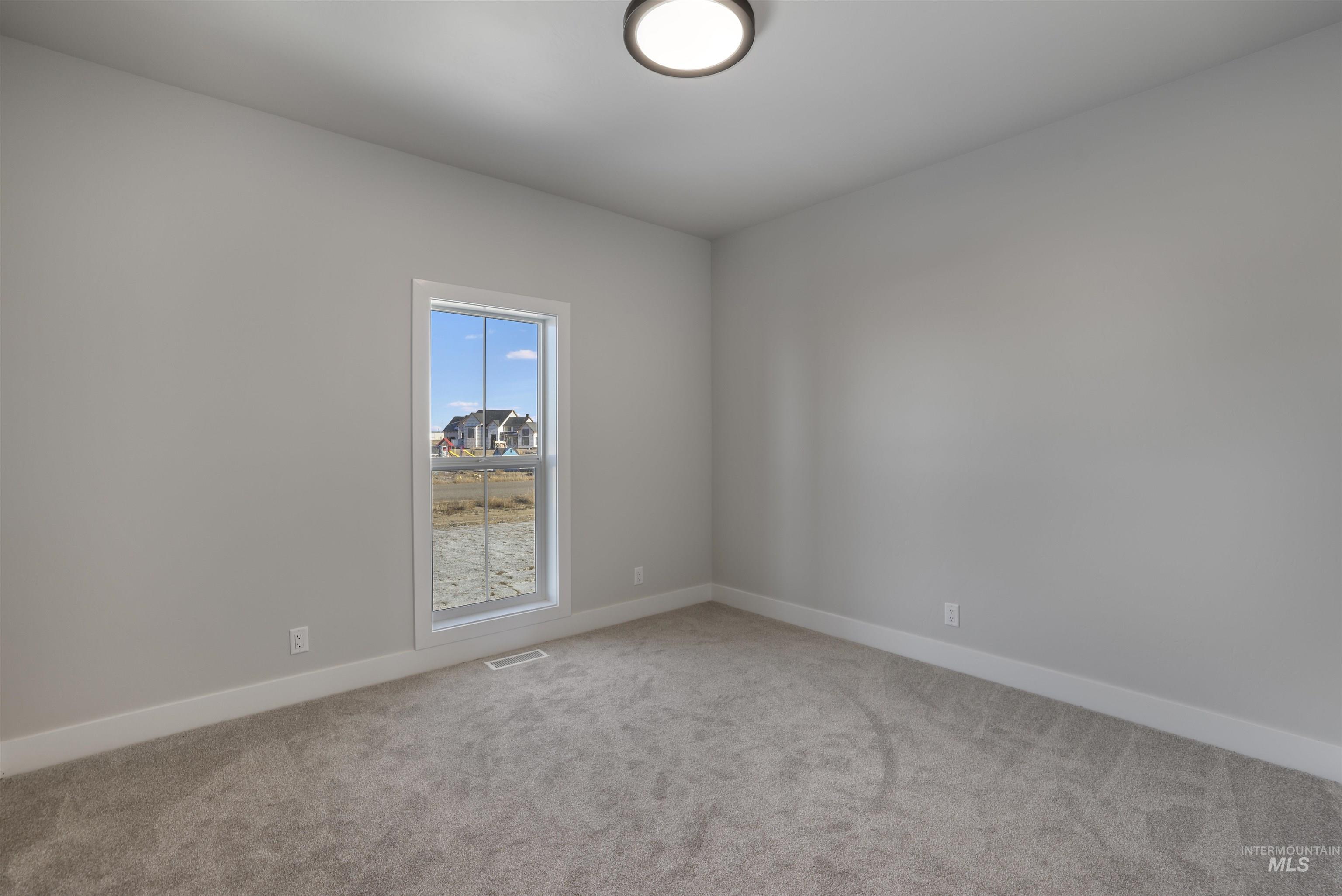 262 Ferdinand Circle Burley, ID 83318 - Photo 31 of 50 Bedroom with carpet floors and baseboards