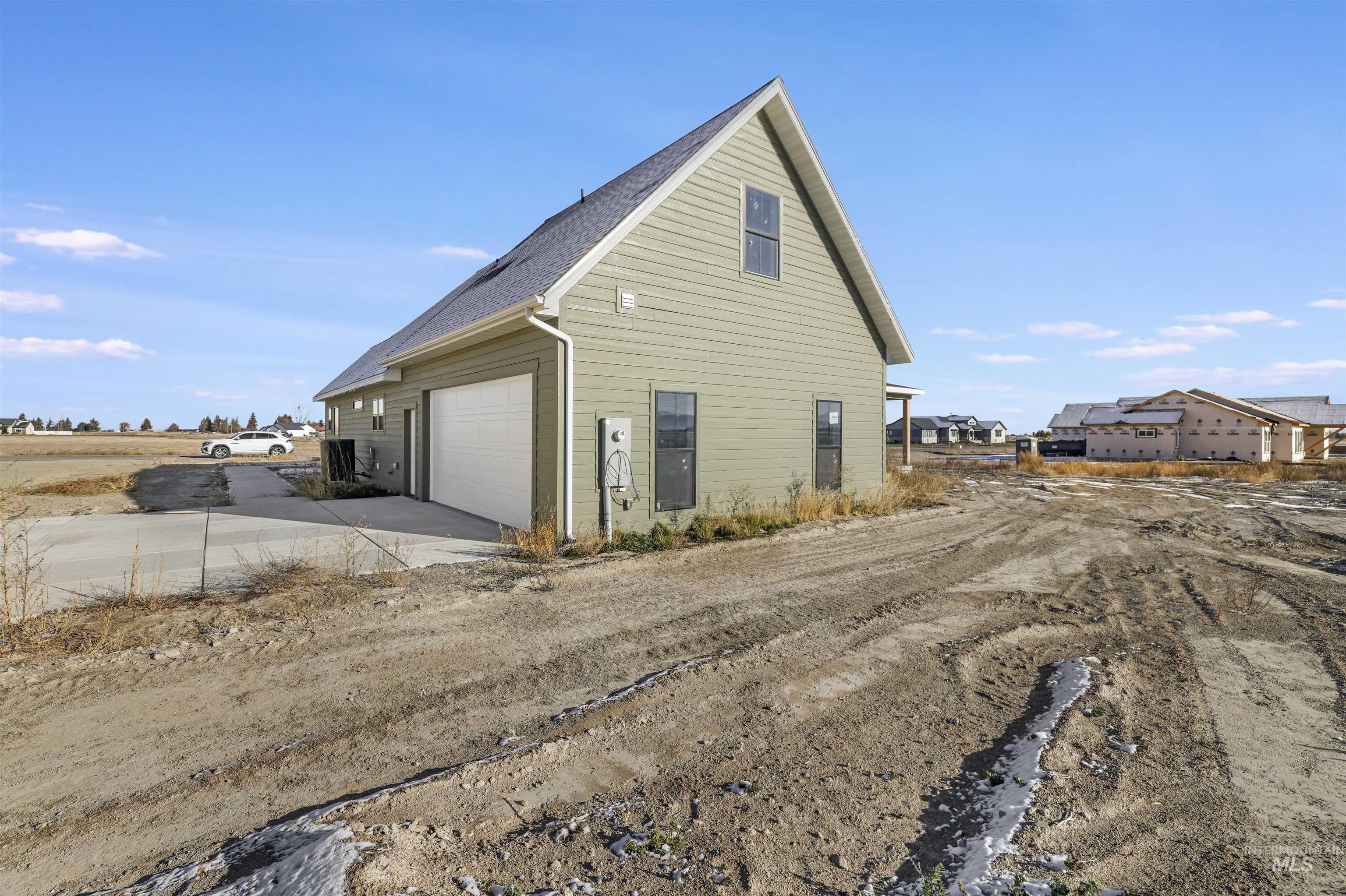 262 Ferdinand Circle Burley, ID 83318 - Photo 39 of 50 View of home's exterior with driveway and roof with shingles