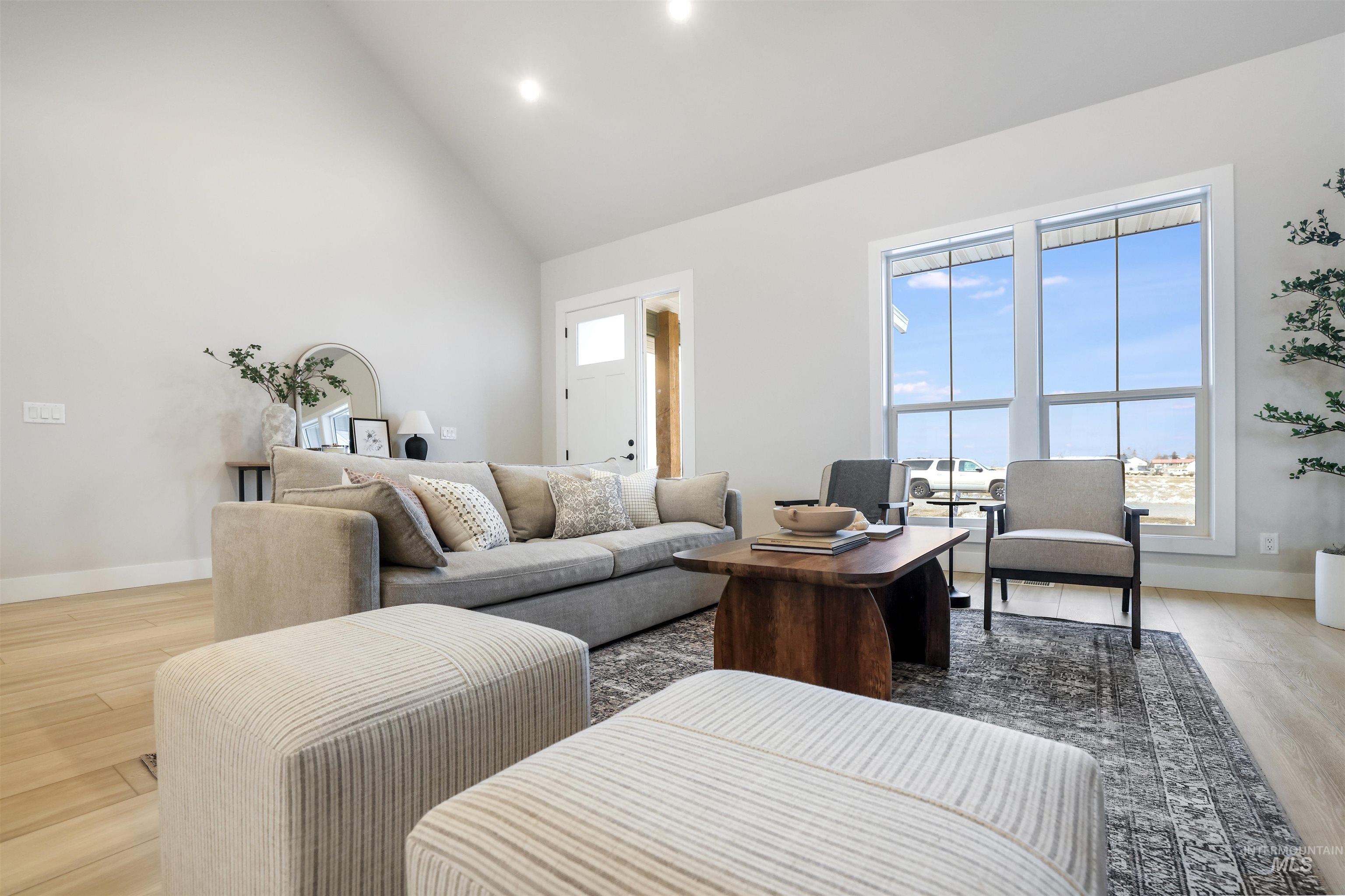 262 Ferdinand Circle Burley, ID 83318 - Photo 10 of 50 Living room featuring light wood-style floors and high vaulted ceiling