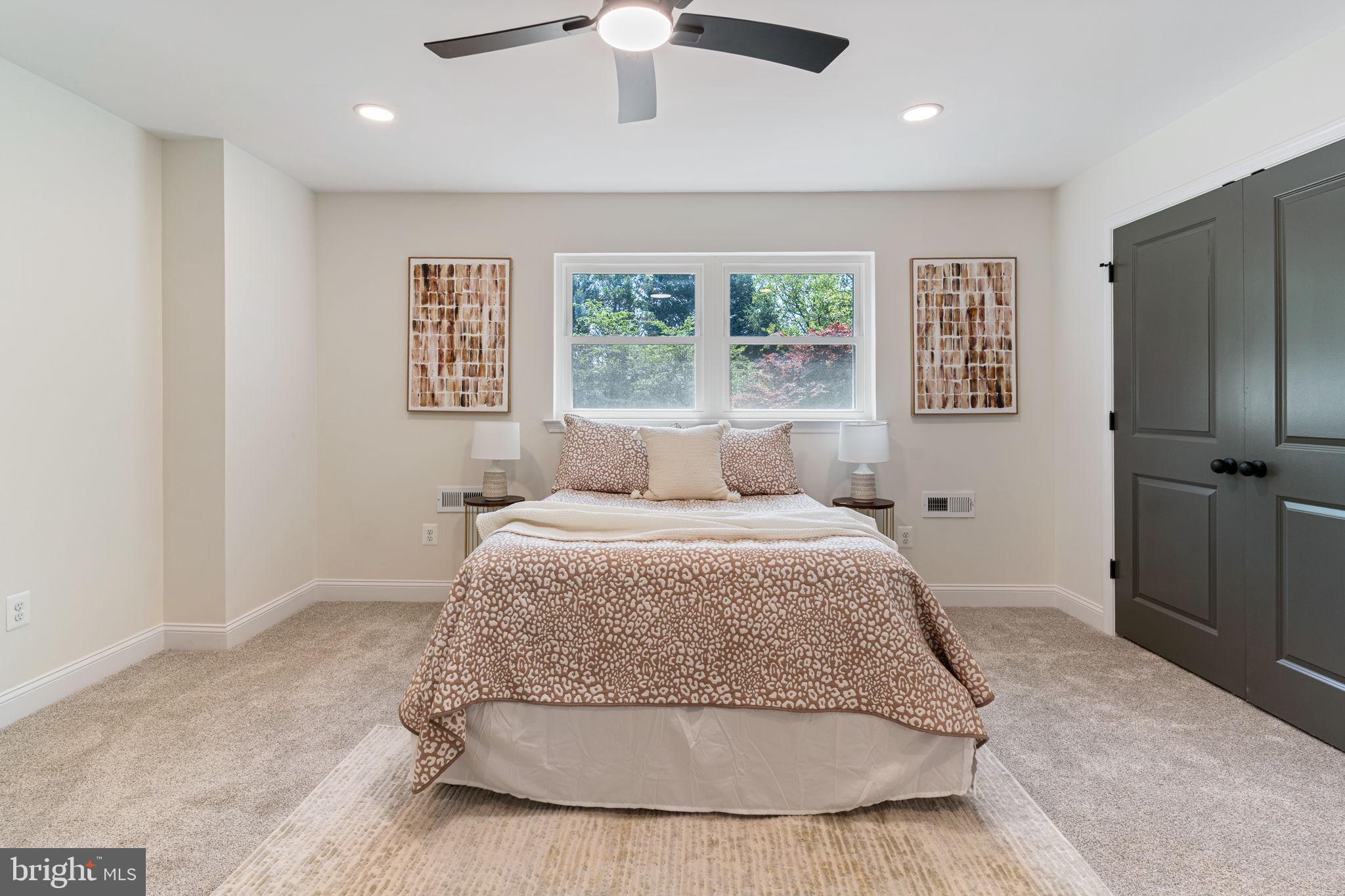 4735 Paul Hance Road Huntingtown, MD 20639 - Photo 36 of 64 a spacious bedroom with a bed and a window