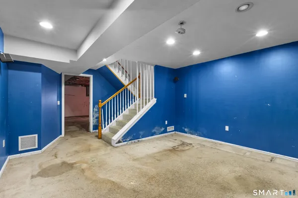 a view of a room with wooden floor
