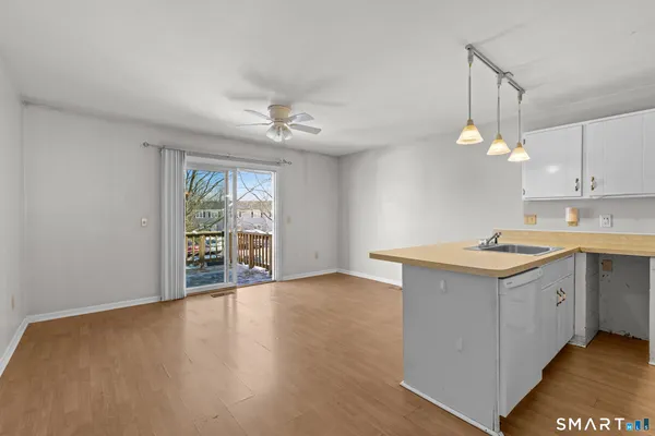 a kitchen with a stove a sink and a refrigerator