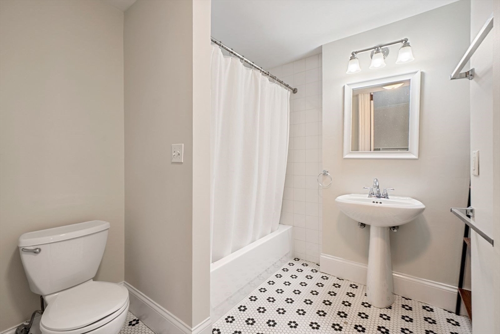 662 Tremont Street, Unit 3 Boston, MA 02118 - Photo 13 of 15 a bathroom with a sink a toilet and shower