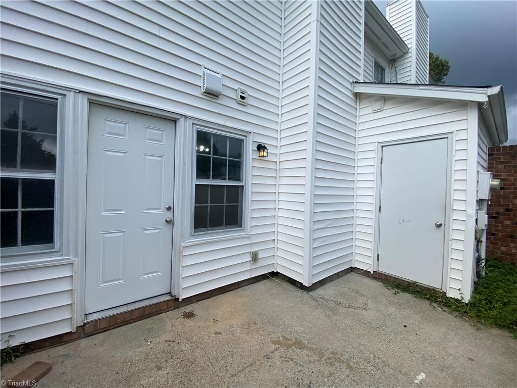 4906 Tower Road, Unit B Greensboro, NC 27410 - Photo 18 of 18 Rear patio fenced with storage area