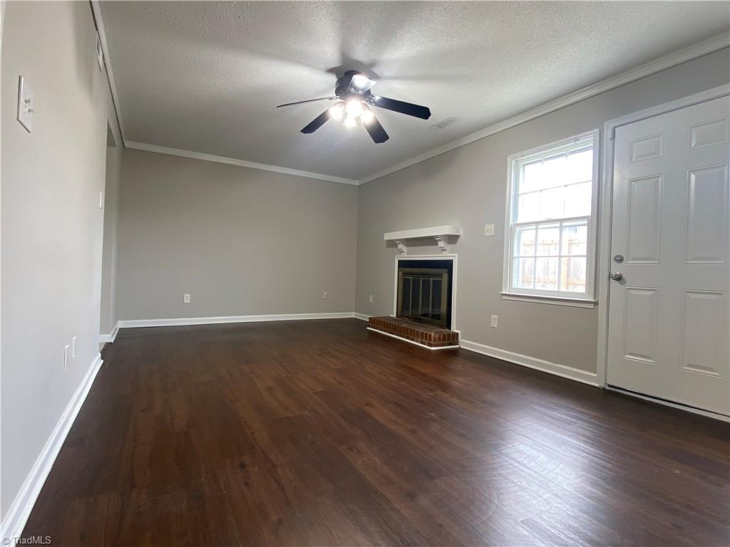 4906 Tower Road, Unit B Greensboro, NC 27410 - Photo 6 of 18 Living room with fireplace