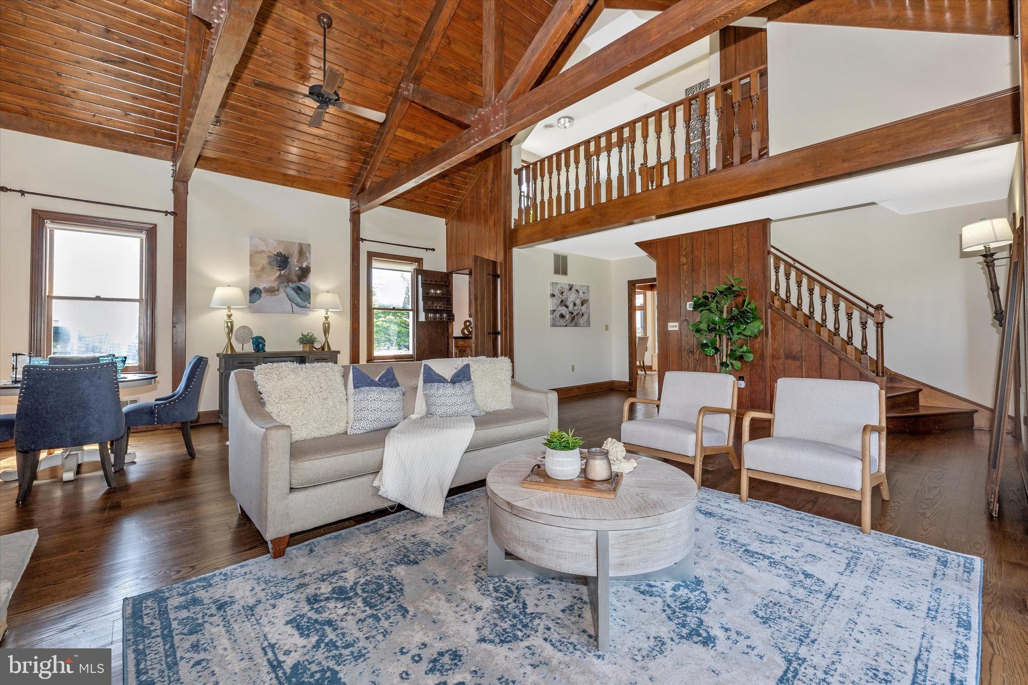8423 Yellow Springs Road Frederick, MD 21702 - Photo 109 of 136 a living room with furniture and a dining table with wooden floor