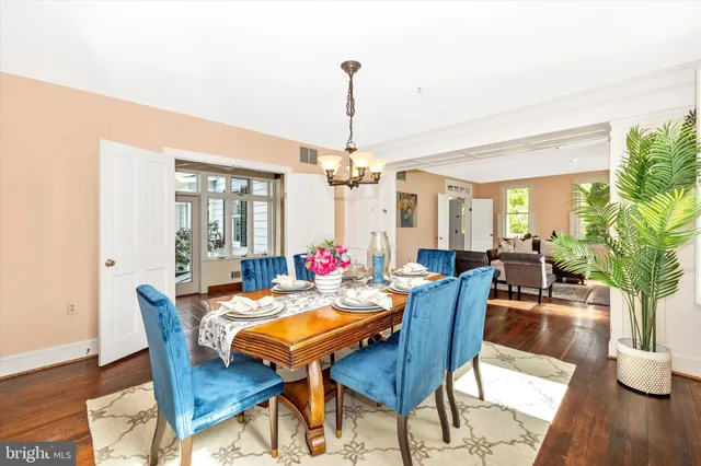 a living room with furniture and floor to ceiling windows