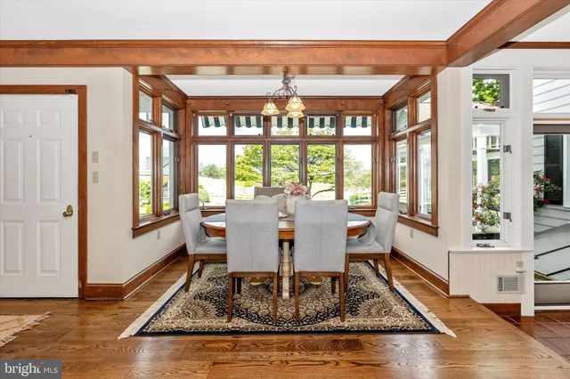 a view of a kitchen with furniture and wooden floor