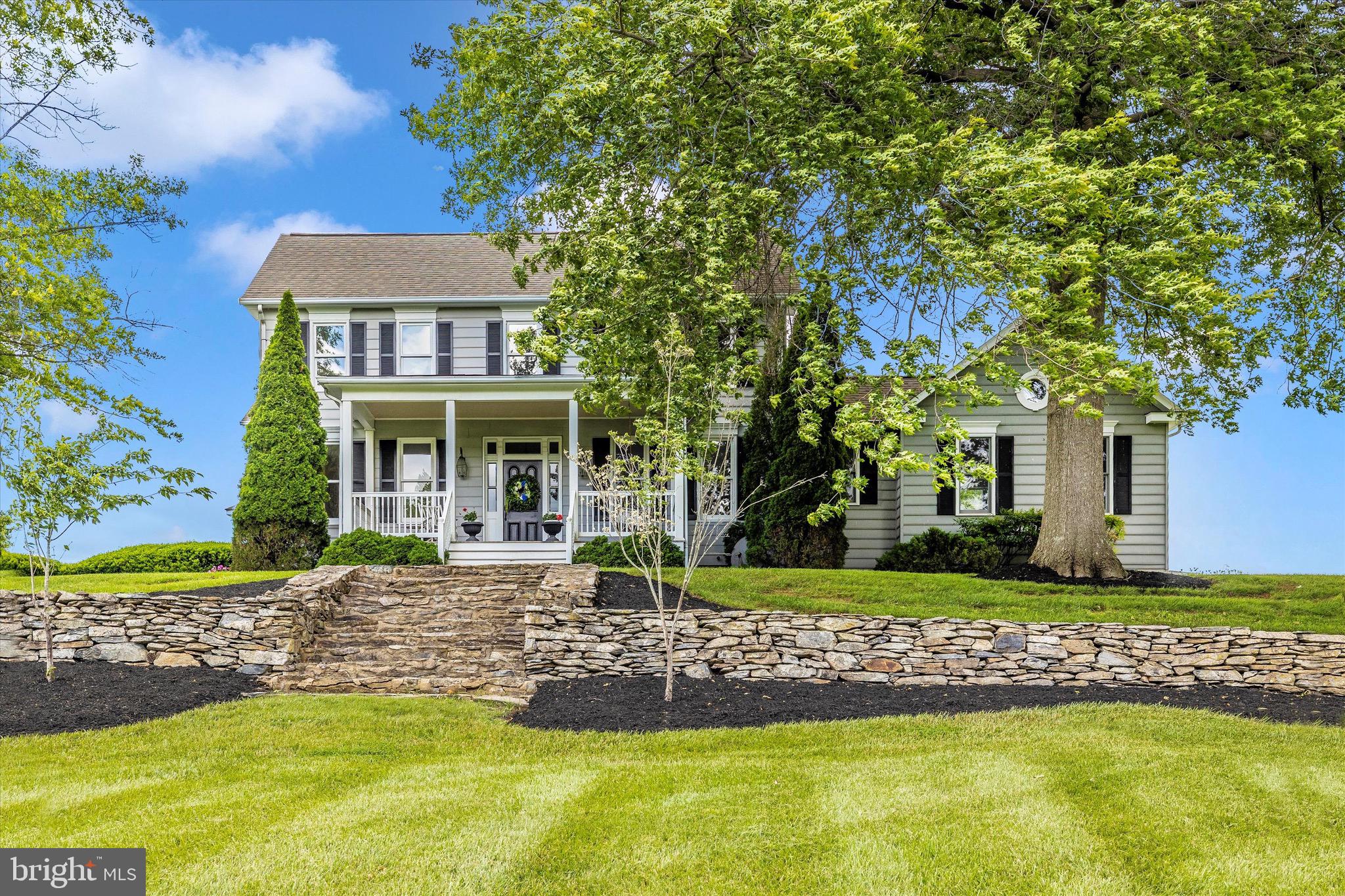 8423 Yellow Springs Road Frederick, MD 21702 - Photo 4 of 136 a front view of a house with a yard