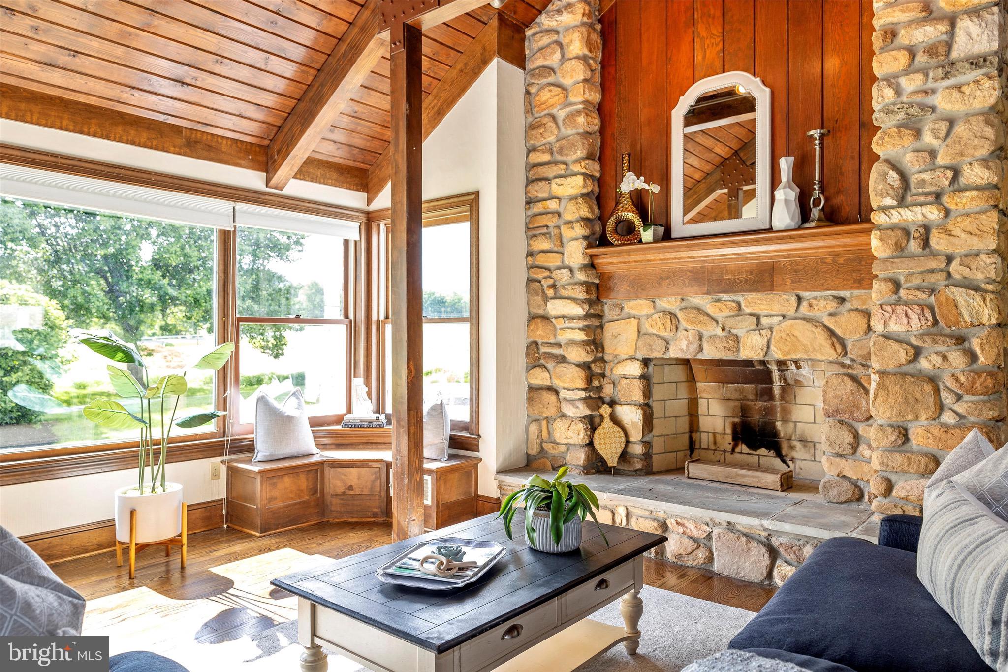 8423 Yellow Springs Road Frederick, MD 21702 - Photo 46 of 136 a living room with fireplace furniture and floor to ceiling windows