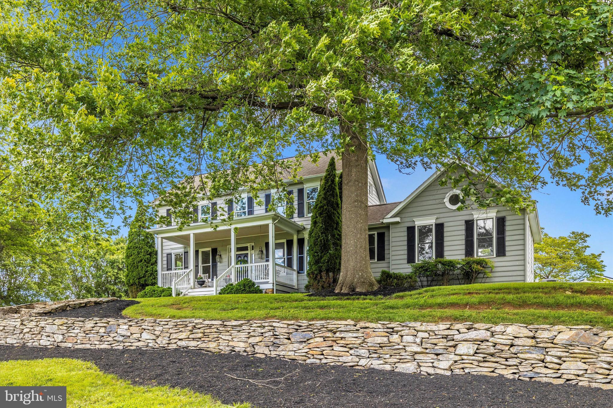 8423 Yellow Springs Road Frederick, MD 21702 - Photo 6 of 136 a front view of a house with a garden