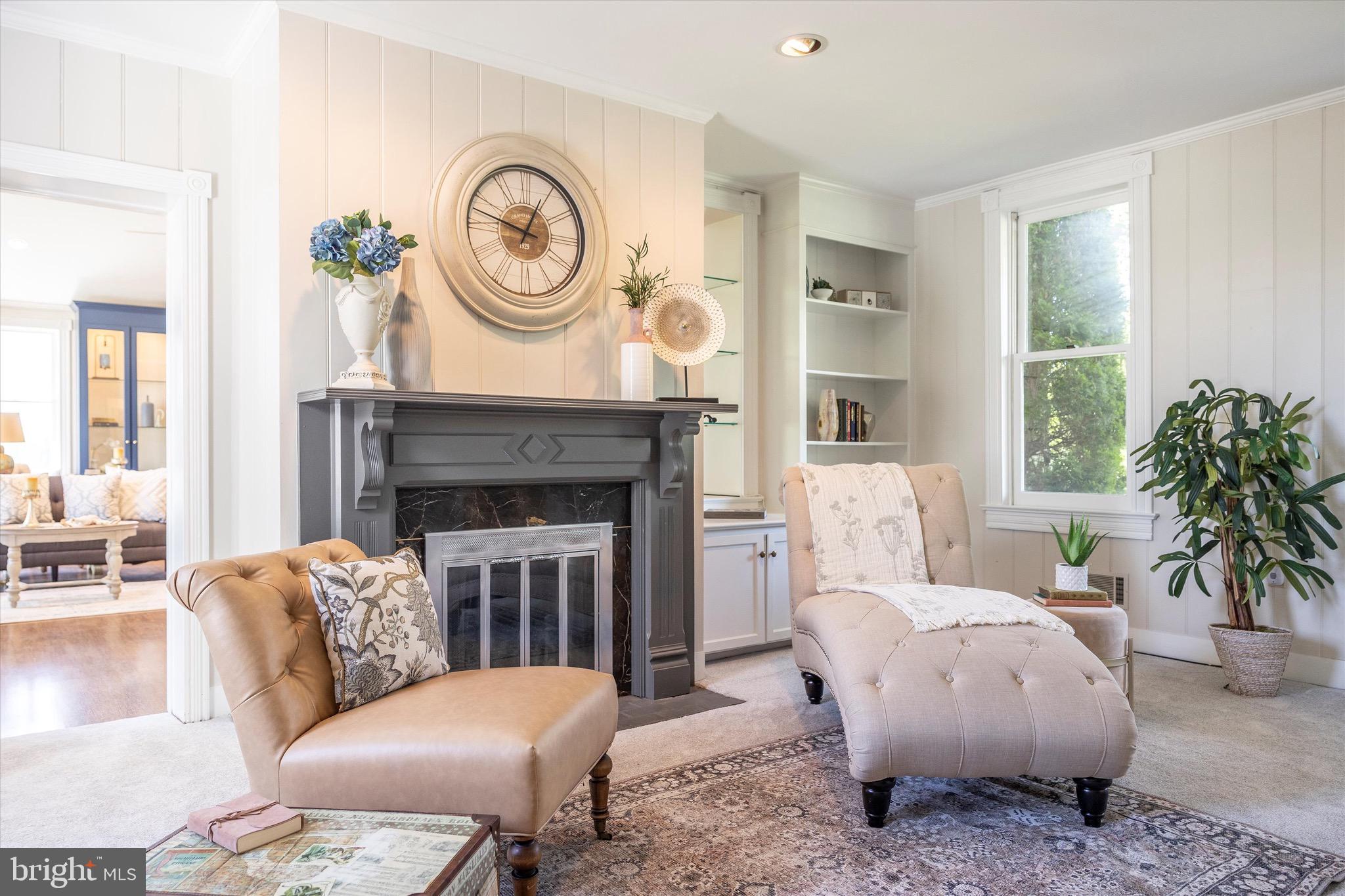 8423 Yellow Springs Road Frederick, MD 21702 - Photo 72 of 136 a living room with furniture a fireplace a rug and a large window