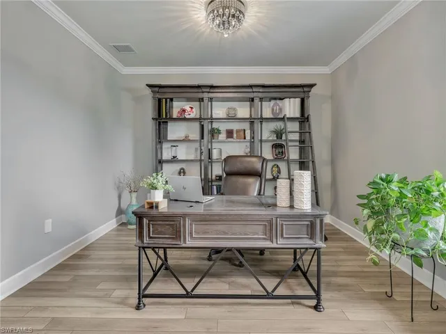 a workspace with furniture and a potted plant
