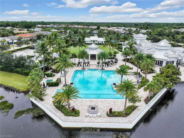 a view of a swimming pool with a yard