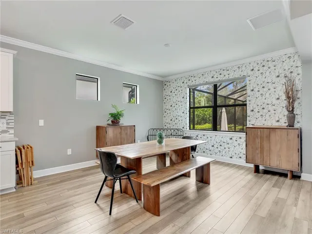 a workspace with furniture window and wooden floor