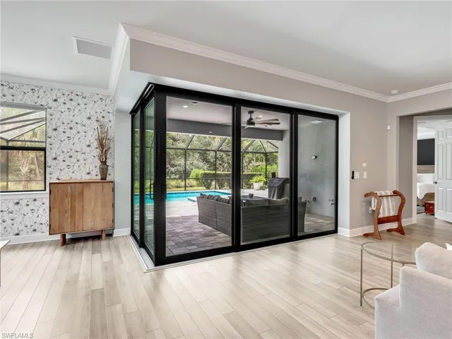 a view of a living room and a balcony