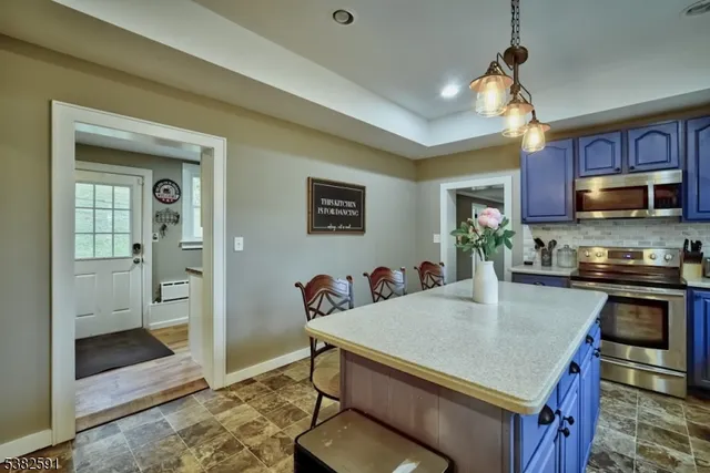 a kitchen with a sink and a large window