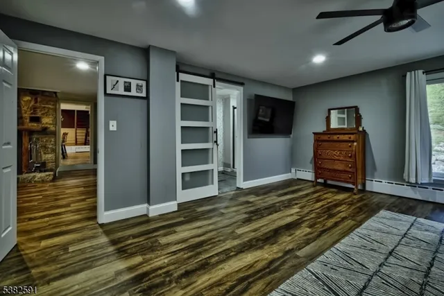 a bathroom with a sink toilet and mirror