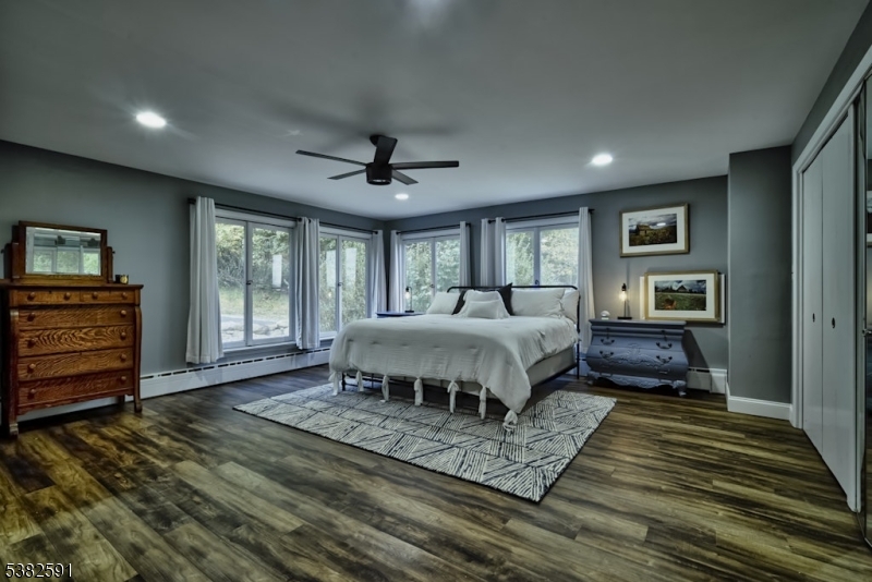 49 Mt Pleasant Road Columbia, NJ 07832 - Photo 33 of 47 a spacious bedroom with a bed a dresser and a large window