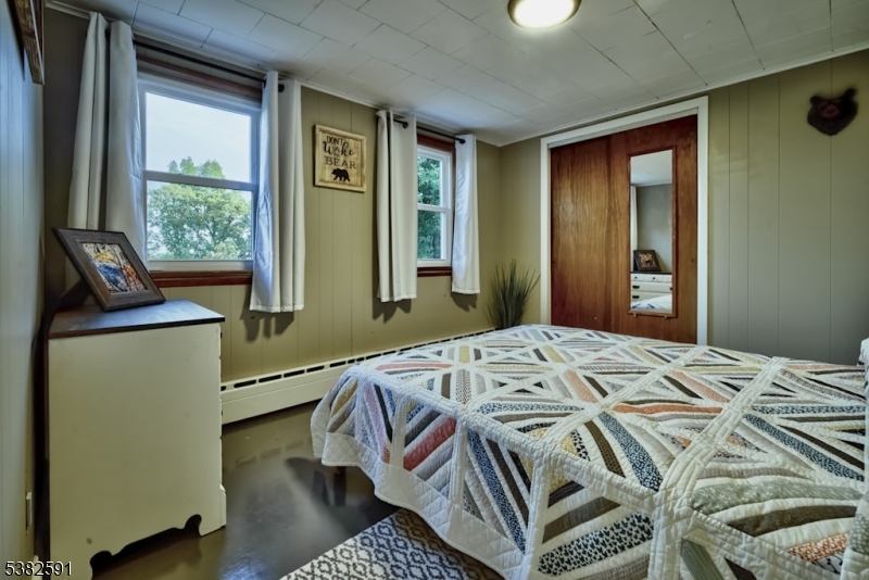 49 Mt Pleasant Road Columbia, NJ 07832 - Photo 37 of 47 a bedroom with a bed and wooden floor