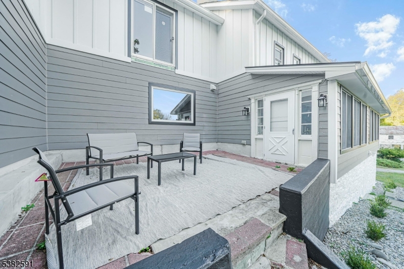 49 Mt Pleasant Road Columbia, NJ 07832 - Photo 6 of 47 a backyard of a house with table and chairs