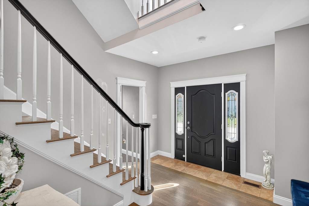 6 Colby Road Danvers, MA 01923 - Photo 2 of 42 a view of entryway with stairs and wooden floor