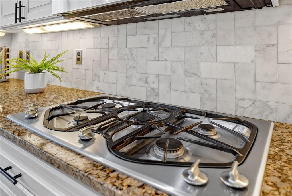 6 Colby Road Danvers, MA 01923 - Photo 9 of 42 a close view of a stove a microwave and a counter