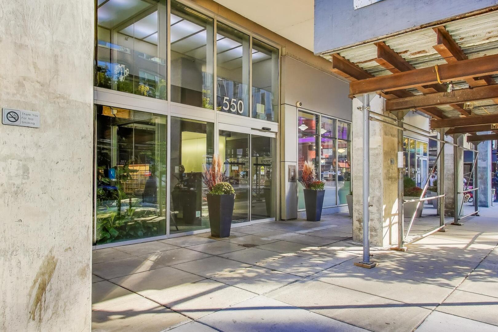 550 North St Clair Street, Unit 1303 Chicago, IL 60611 - Photo 3 of 20 a view of a building with a outdoor space