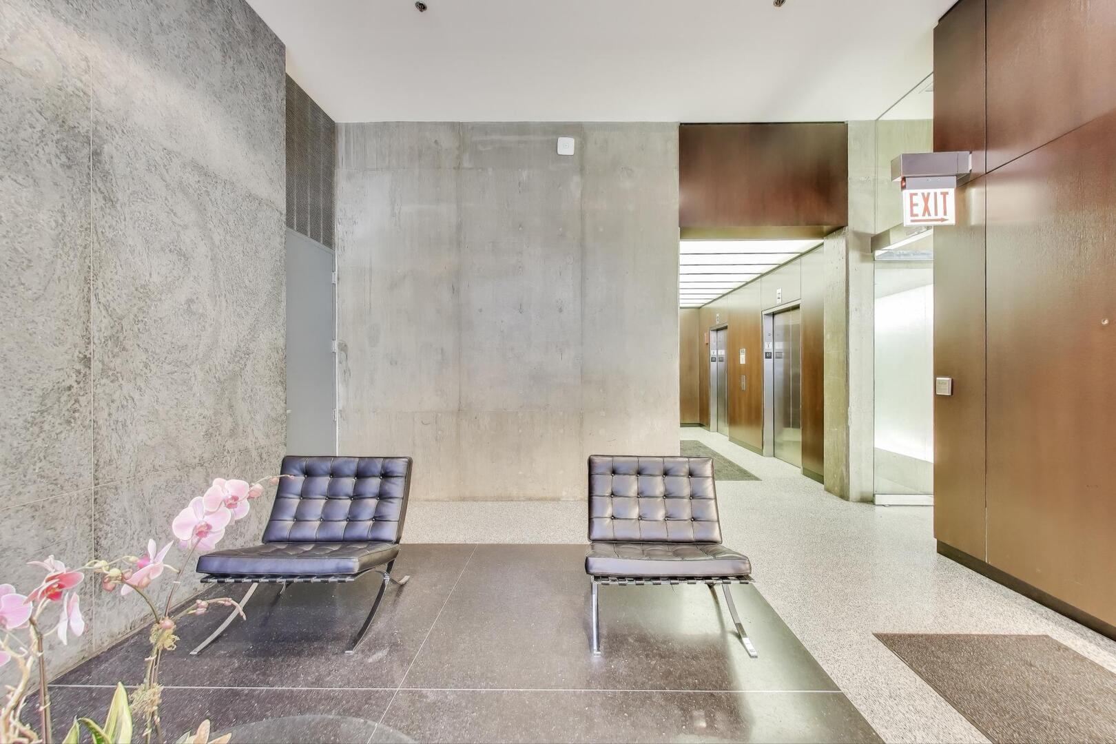 550 North St Clair Street, Unit 1303 Chicago, IL 60611 - Photo 6 of 20 a living room with furniture and wooden floor