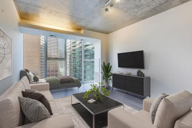 a living room with furniture and a flat screen tv