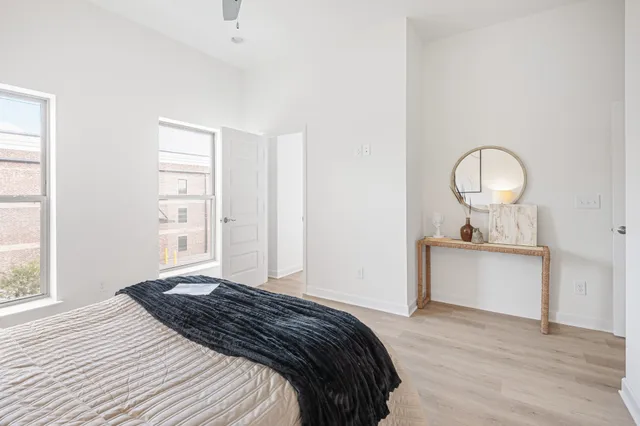 a bedroom with a bed and a window